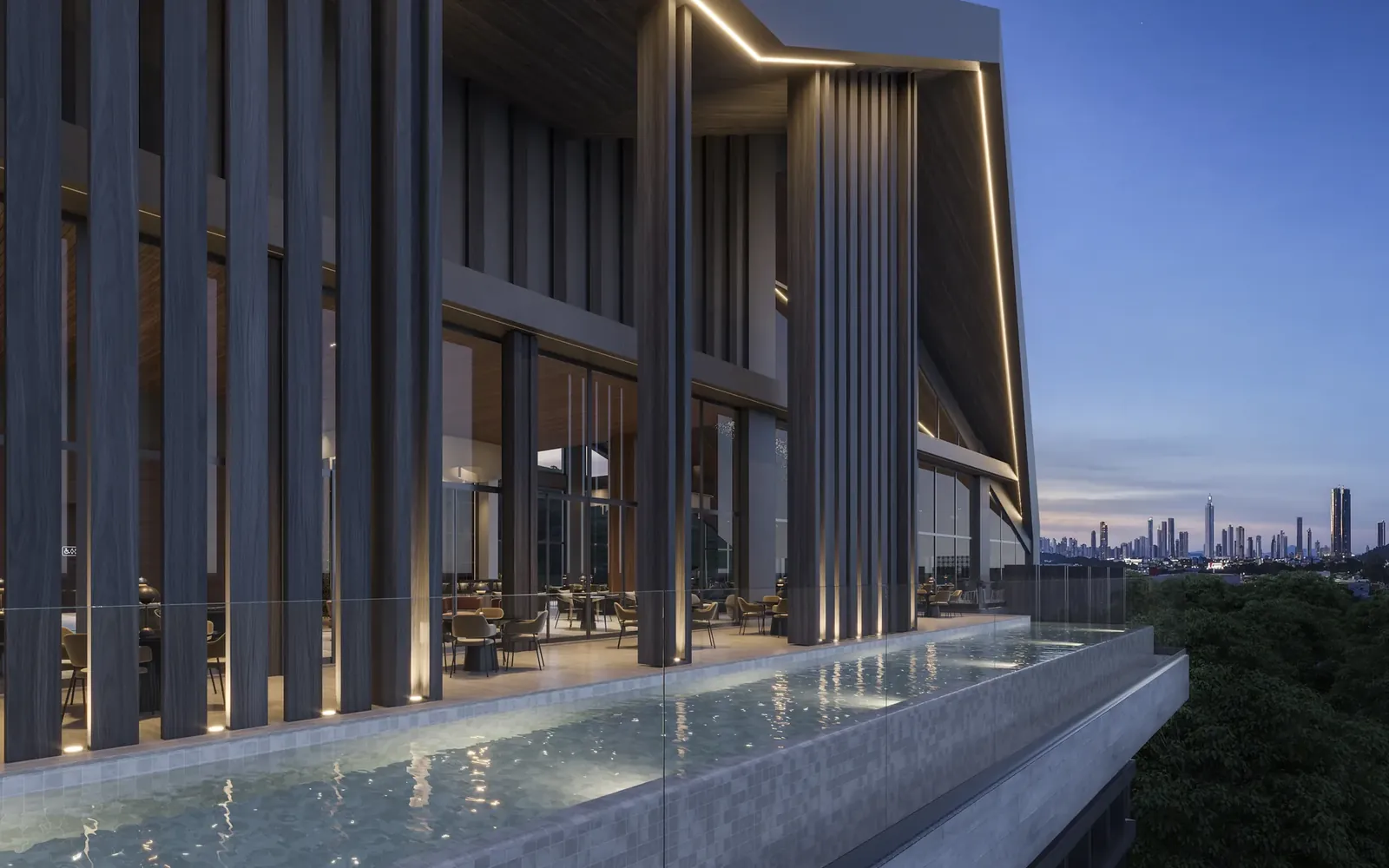 Piscina suspensa com o skyline de Balneário Camboriú ao entardecer
